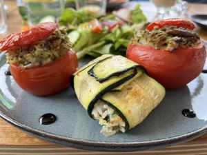 Stuffed tomatoes and courgette parcel with rice. The vegan dishes of the day. They kindly let us sample both on one plate    at Floe in La Plagne-tarentaise