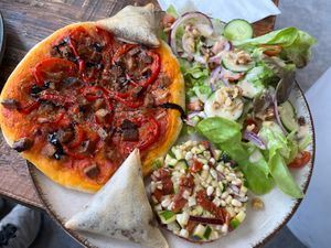 Booked the 3 vegan meals the day before. Fougasse with smoked tofu, samosas with mushroom and onion, and pine nut with courgette and sun dried tomatoes circle and salad with walnu  at Floe in La Plagne-tarentaise