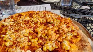 Elote pizza - a hint of heat from the chorizo combined with creamy corn at Pig Minds Brewing in Machesney Park