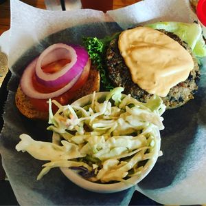 Delicious burger with coleslaw at Pig Minds Brewing in Machesney Park