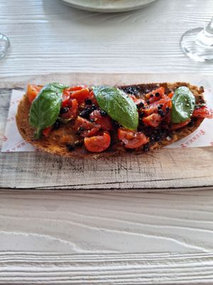Sourdough crostini with cherry tomatoes and balsamic pearls at Sienna's in Dublin