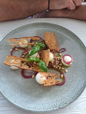 Honey dew melon and basil salad with ciabatta crisps, toasted pine nuts and basil oil at Sienna's in Dublin