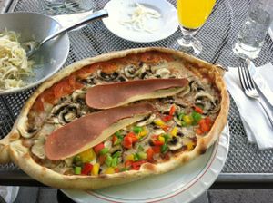 vegan pizza with veggies and bacon at O'Mamma Mia in Stockholm