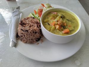 Vegetable curry with 2 sides for $10 USD at Chef Juan's Kitchen and Pastries in Caye Caulker