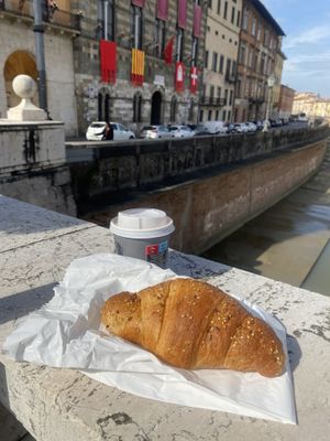 Croissant with orange jam  at House Cafe in Pisa