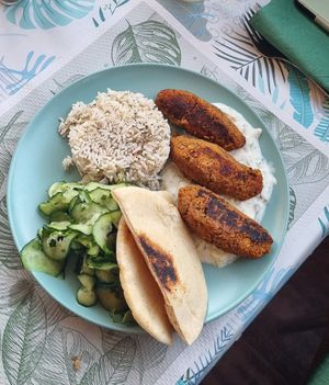 Lentil sausages with seasoned rice at Bij Fleur in Torrox Costa