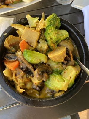 Delicious curry vegetable bowl with vegan chicken   at The Purple Elephant in Northport