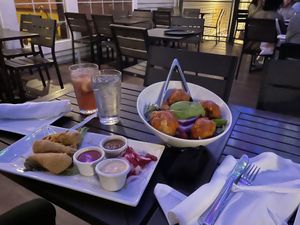 Pictured: Vegan Wings and Buffalo Cauliflower salad  at The Purple Elephant in Northport