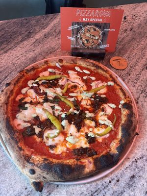 Spiced ‘lamb’ pizza with kale, basil & chimichurri + plant-based mozzarella   at Pizzarova in Bristol