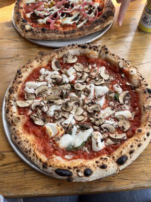 We got the vegan lamb pizza and a vegan margherita with mushrooms  at Pizzarova in Bristol