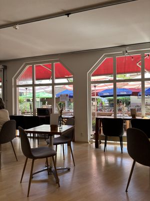 Other indoor tables looking out to the riverside tables  at Gecco Café & Concept Store in Buehl