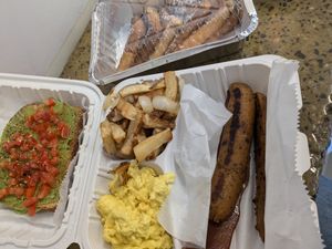 Vegan breakfast- "The Slam"- includes sausage, bacon, scrambled eggs, hash browns, avocado toast, and French toast with maple syrup at The Supreme Dessert Shop in Willingboro