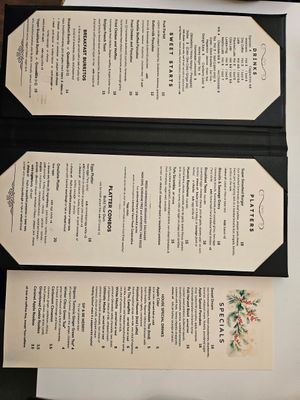 Menus with clearly labeled vegan items at 3j's Cafe in Philadelphia