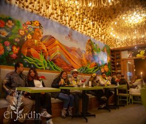 El Inca y su Colla tomando cafe at El Jardin Healthy Food And Coffee in Cusco