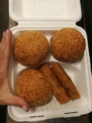 Sesame balls to go. Got the spring rolls for free. Thank you! at ChuMinh Tofu and Veggie Deli in Seattle