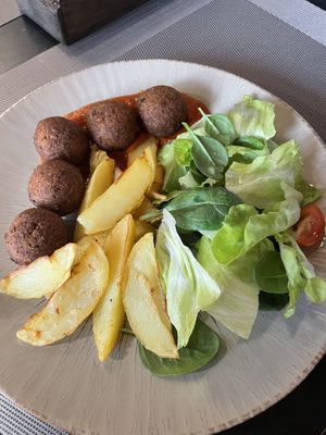 Croquets, potatoes and salad  at Agni Food in Vilnius