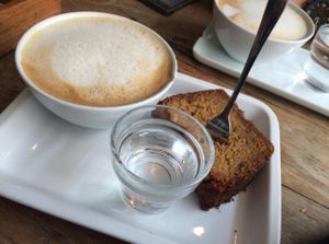 delicious slice with coffee  at Deli Kitchen in Munich