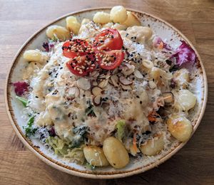 Fried gnocchi with sage and garlic and salad at Deli Kitchen in Munich