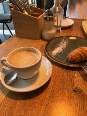 vegan croissant and cappuccino  at Deli Kitchen in Munich