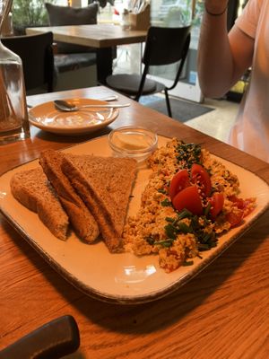 scrambled tofu, bread and vegan butter  at Deli Kitchen in Munich