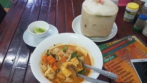 Tom Yum Soup 40k Kip, Coconut 30k Kip at Kaun Im Yok Vegan Restaurant - H&H in Vang Vieng
