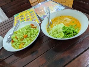 Cucumber salad and coconut noodle soup at Kaun Im Yok Vegan Restaurant - H&H in Vang Vieng