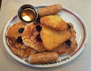 Vegan pancakes, hash browns and sausages at The Breakfast Club - Soho on Berwick St in London