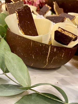 Our “pasteli “ - artisanal sesame bar with a touch of salt,  enrobed with 70% guanaja at MINA Handmade Chocolates in Sint-genesius-rode