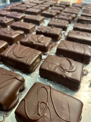 Shahrazad- vegan- tahini, dark chocolate- caramelised and salted almonds at MINA Handmade Chocolates in Sint-genesius-rode