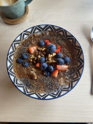 cinnamon and maple syrup porridge made with coconut milk  at C O M B in Edinburgh