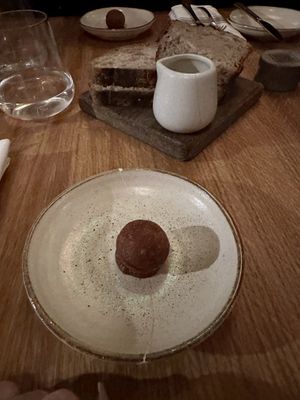 Pre dinner complimentary savory chickpea doughnut  at Apricity in London