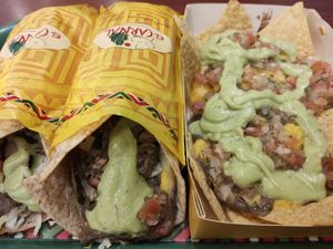Traditional vegan burrito and vegan nachos at El Carnal - Portal 80 in Bogota