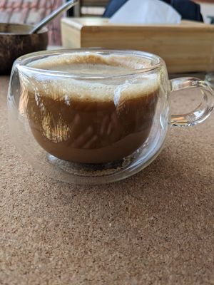 Coffee with plant mylk and date syrup at Cafe Graze - Plant Based Kitchen by Natureville in Bangalore