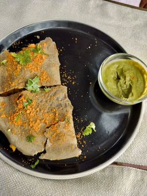 Barnyard Millet Dosa, filled with spiced potato, served with green chutney & coconut ghee podi at Cafe Graze - Plant Based Kitchen by Natureville in Bangalore