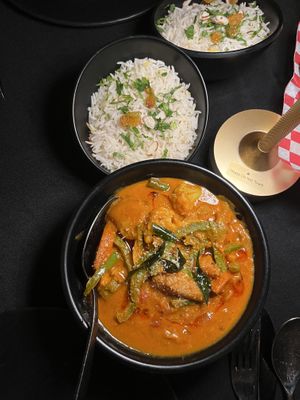 Curries served with ricee  at Delhi6 Indian Kitchen in Highland Village