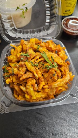 Onion Bhaji , very similar to onion rings. Comes with sauces at Delhi6 Indian Kitchen in Highland Village
