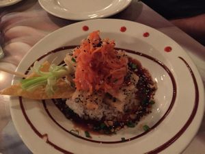 fried sesame tofu with sticky rice in a spicy sauce with ginger carrot topping, just yummy! at Kaya Island Eats in Key West