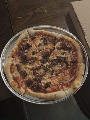 Caramelized onions, olives, and garlic vegan pizza   at Sky High Pie in Joshua Tree