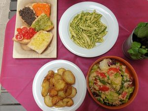 Mixed bruschetta €6.00, Pasta with Umbrian pesto €11.00, Roast potatoes €5.00, Panzanella €5.00 at Degli Orti in Assisi