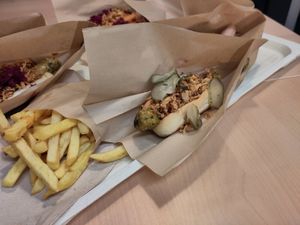 Green vegetable sausage with pickles and onion at IKEA in Lhospitalet De Llobregat