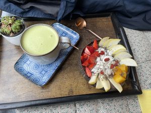 Superpower bowl with a matcha latte  at Acai Poke in Prague