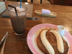 mocca soy latte and pancake with banana  at Bonita Cafe and Social Club in Bangkok