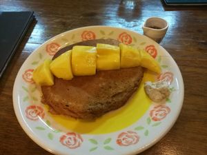 Awesome wholewheat pancake topped with butter-like mangoes at Bonita Cafe and Social Club in Bangkok
