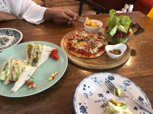 Club sandwich and pizza plate at Bonita Cafe and Social Club in Bangkok
