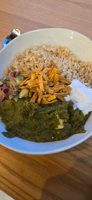 Palak Paneer (spinach curry, tofu, brown rice, cucumber salsa, coconut yogurt, tortilla strips). Dish is vegan and dairy-free (the "paneer" is tofu). at Kokomo  in Port Moody