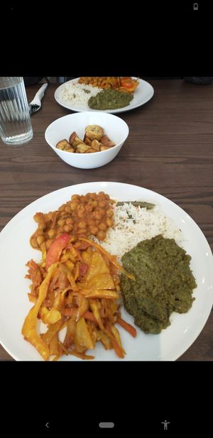 Coconut rice, chickpea curry, peanut butter supergreens, spiced veg and roasted plantain at MaRobert's in Edinburgh