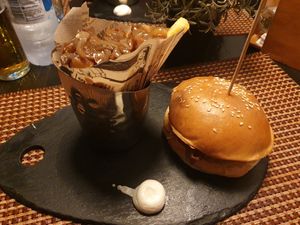 Quinoa burger and fries with onions at Meky's Burger Bar in Santa Maria