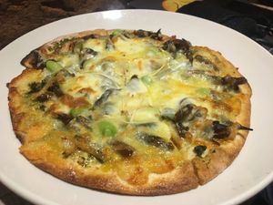 Seaweed & black ear mushroom pizza - this one is my friends = non-vegan cheese. at So Free Pizza - Ximen in Taipei