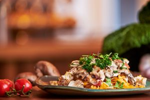 Creamy gluten free pasta dish with mushrooms, paprika, cauliflower, sundried tomatoes and pickled onions, topped with microgreens at Nordur in Aalborg