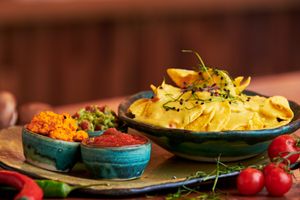 Nachos with homemade cheasy sauce, salsa sauce, guacamole and chili hummus at Nordur in Aalborg